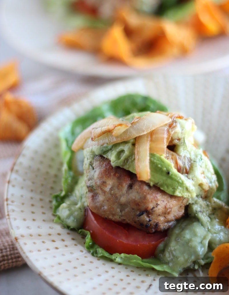 Stuffed Bacon Turkey Burgers - juicy, delicious turkey burgers are loaded with bacon, dairy-free cheese, caramelized onions, and avocado ranch dressing! | fedandfulfilled.com