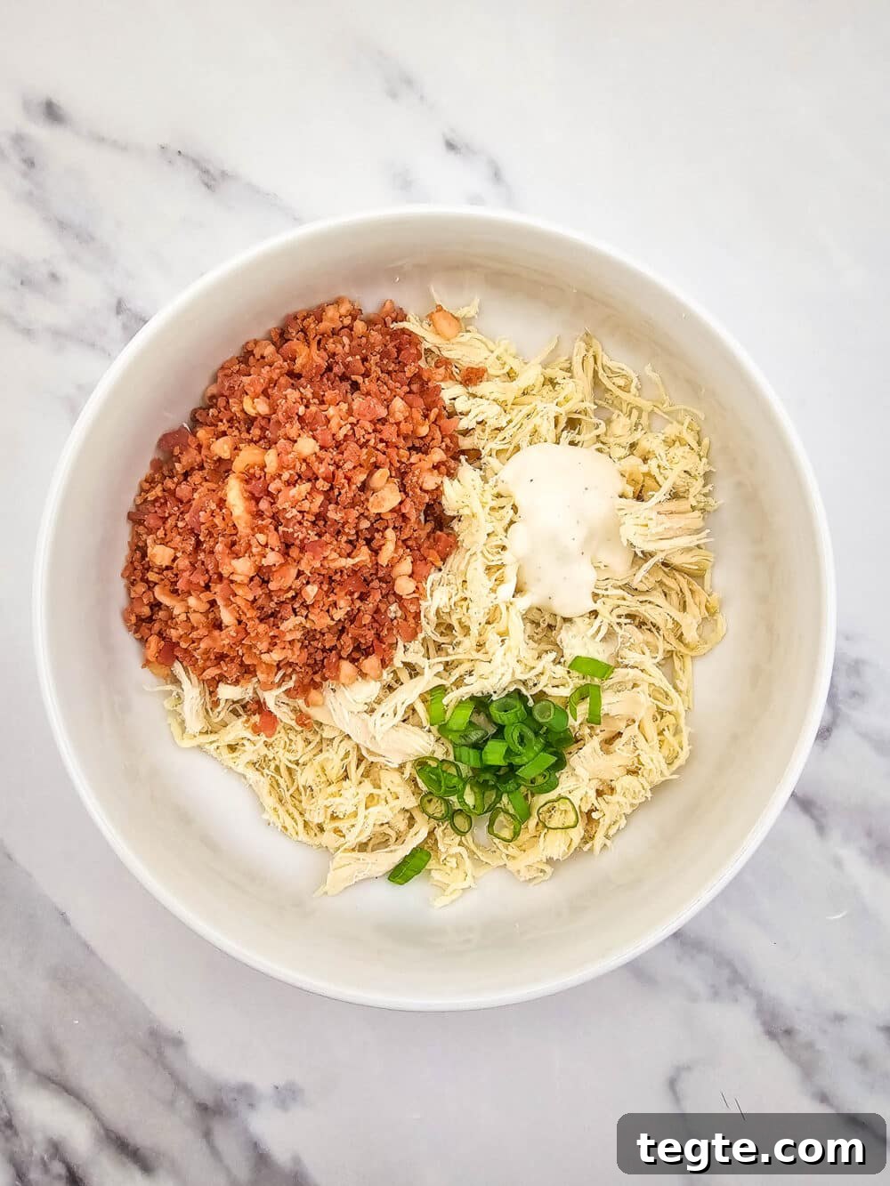 bowl of ingredients for Keto Chicken Bacon Ranch Bites