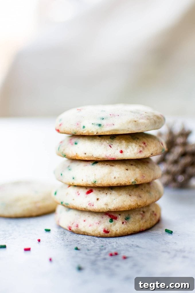 stack of five vegan sugar cookies with red and green sprinkles