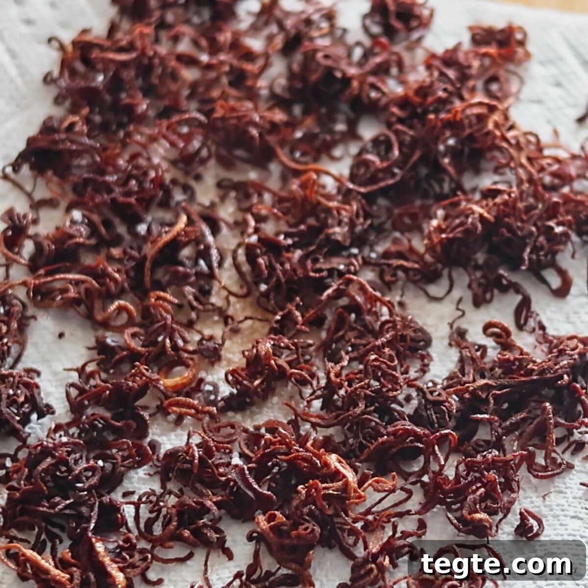 Gluten-Free Green Bean Casserole Recipe for Holiday Dinners 9 fried shallots draining on paper towel.