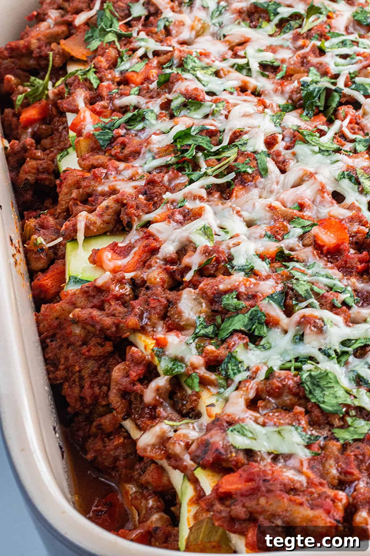 Zucchini Lasagna with Rich Bolognese Meat Sauce 8 Freshly baked homemade zucchini lasagna with parmesan cheese and parsley.