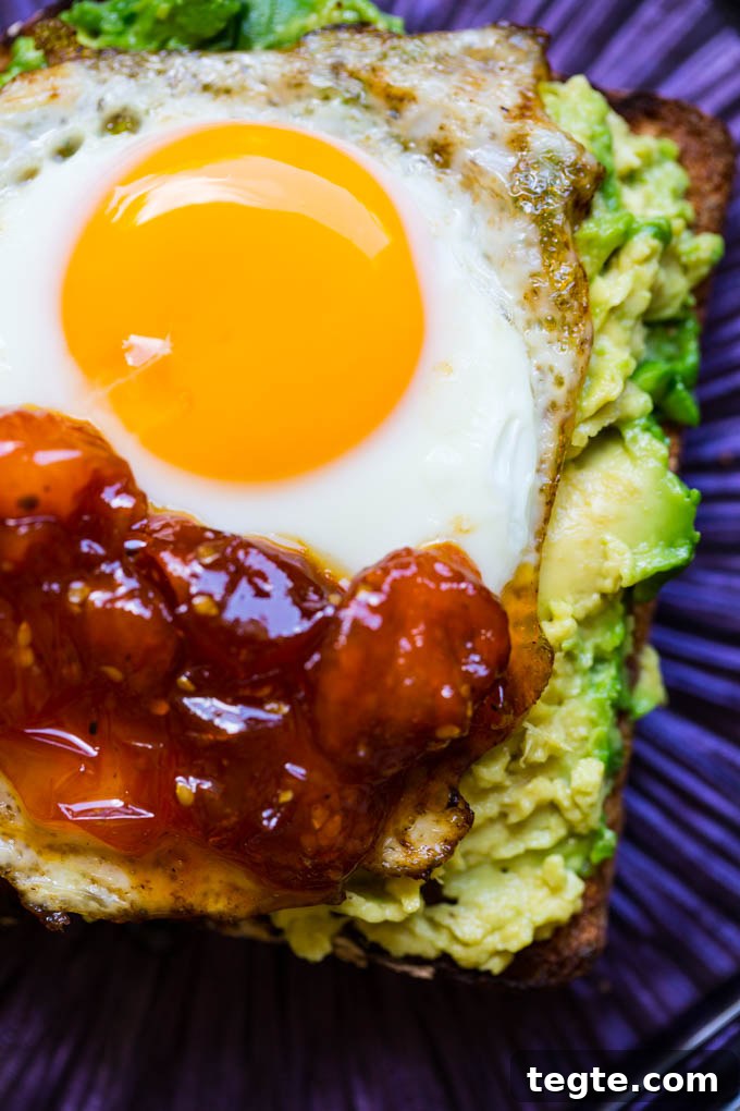 Poached Egg on Avocado Toast with Sweet Tomato Jam 3 Sunny Side Up Egg on Avocado Toast with Tomato Jam