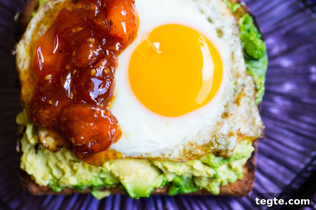 Poached Egg on Avocado Toast with Sweet Tomato Jam 5 Egg on Avocado Toast with Tomato Jam