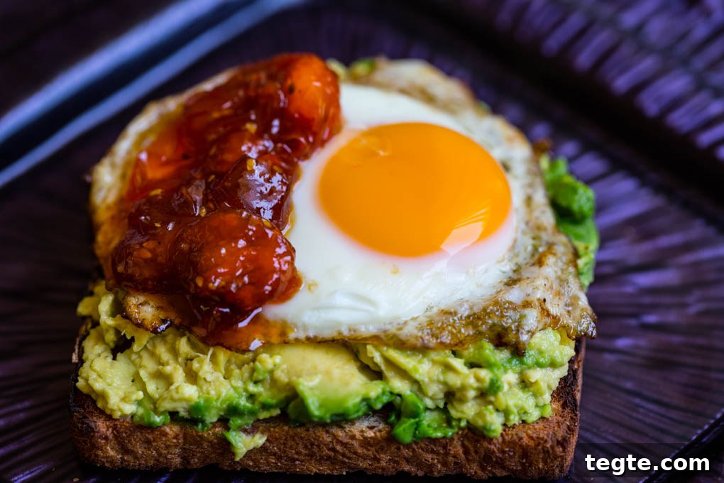 Poached Egg on Avocado Toast with Sweet Tomato Jam 6 Egg on Avocado Toast with Tomato Jam