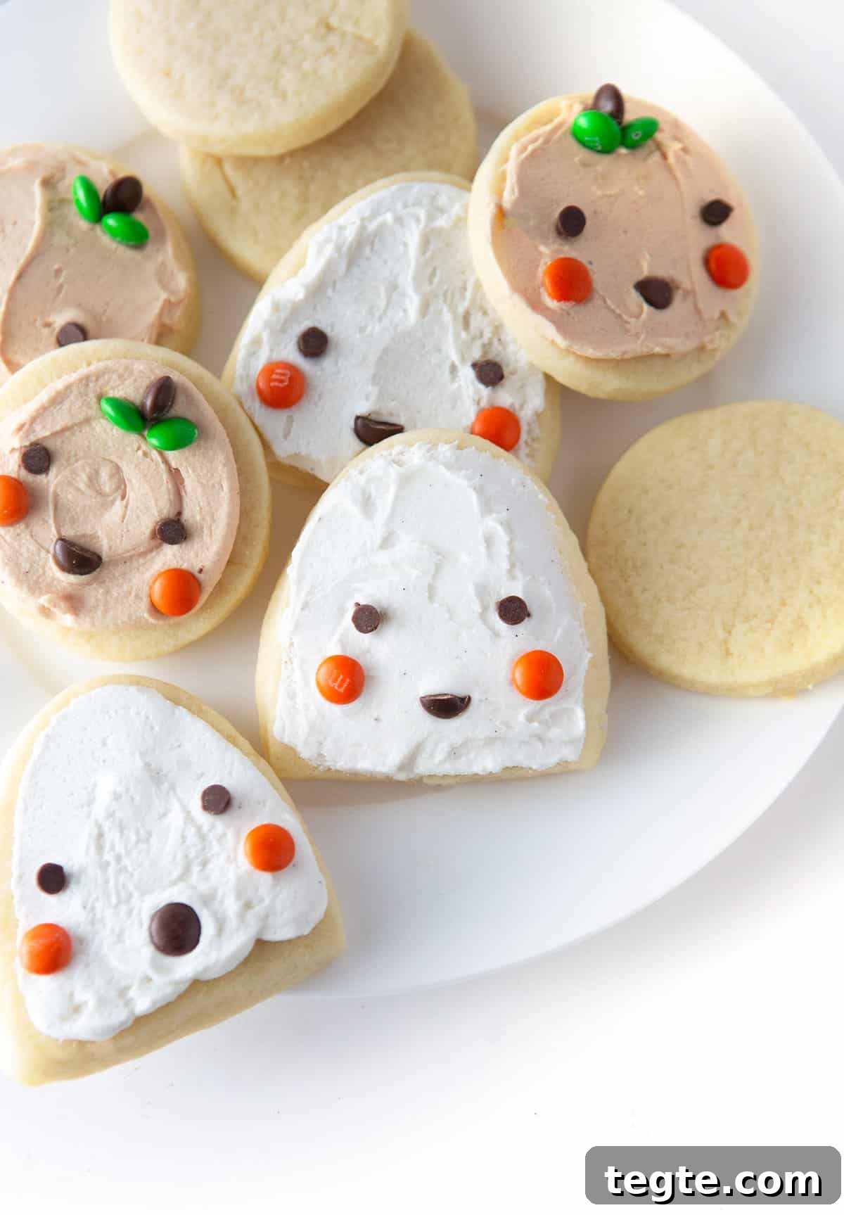 Easy Halloween Pumpkin and Ghost Cookies using cut out sugar cookies and mini M&M's
