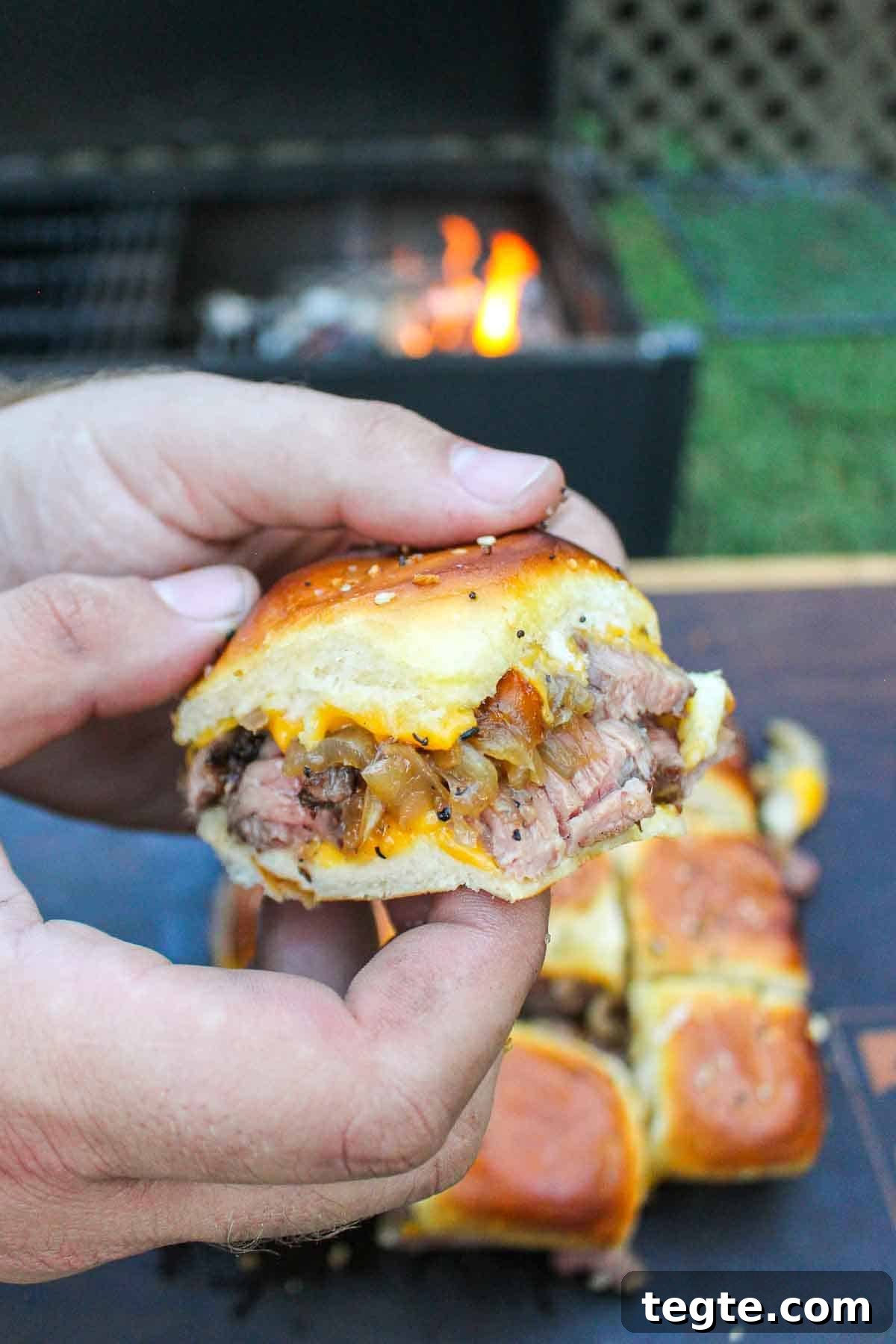 Steak Sliders with Creamy Beer Cheese Sauce 9 A close up shot of a single steak slider.