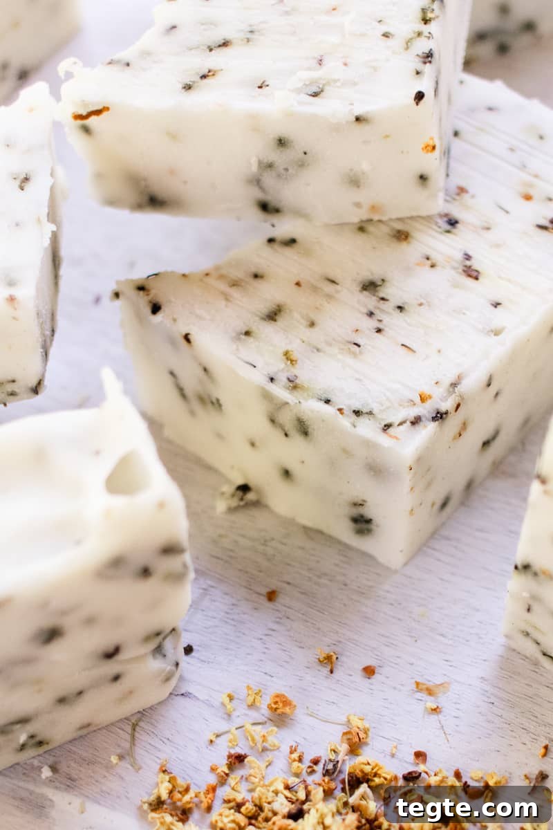 Make Herbal Soap Using Dried Herbs: Step-by-Step Guide 14 Herb soap bars stacked on a white vanity.