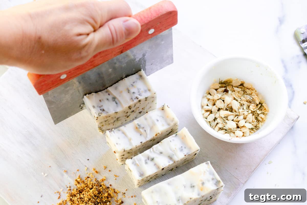 Make Herbal Soap Using Dried Herbs: Step-by-Step Guide 15 Using a soap knife to cut the herbal soap bars into one inch bars.
