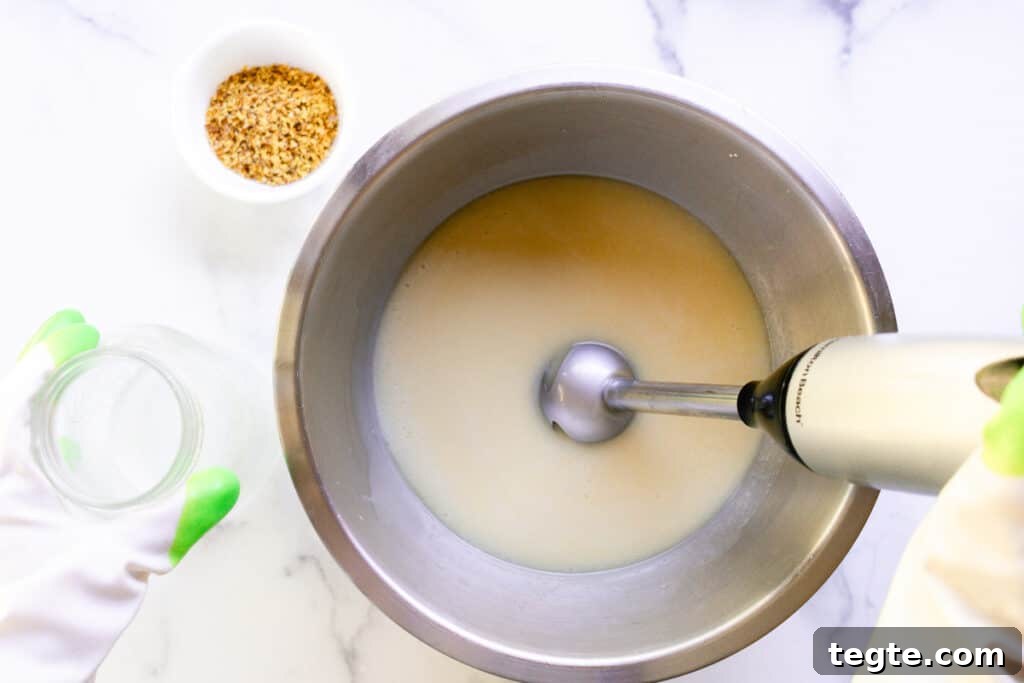 Make Herbal Soap Using Dried Herbs: Step-by-Step Guide 5 Mixing the soap with an immersion blender.