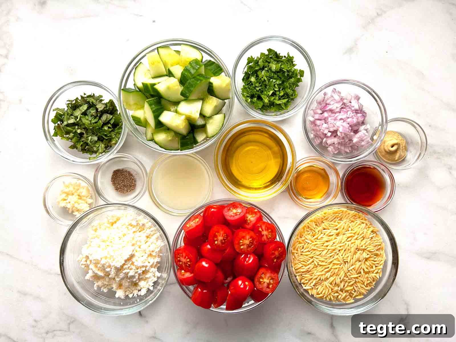 Mediterranean Orzo Salad with Lemon Herb Vinaigrette 3 ingredients prepped in bowls.