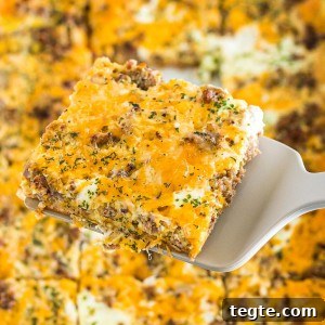 The best Breakfast Sausage Casserole with a layer of cheese, eggs, crescent dough, and sausage!