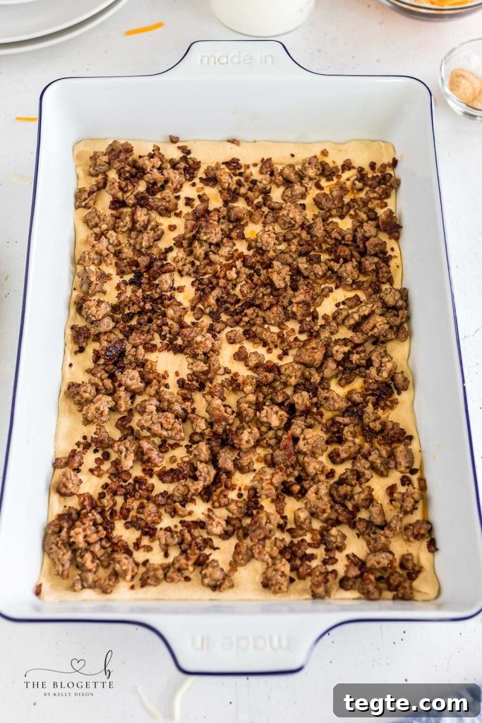 Cheesy Breakfast Sausage Casserole with Crispy Hash Browns 5 Breakfast casserole with crescent rolls