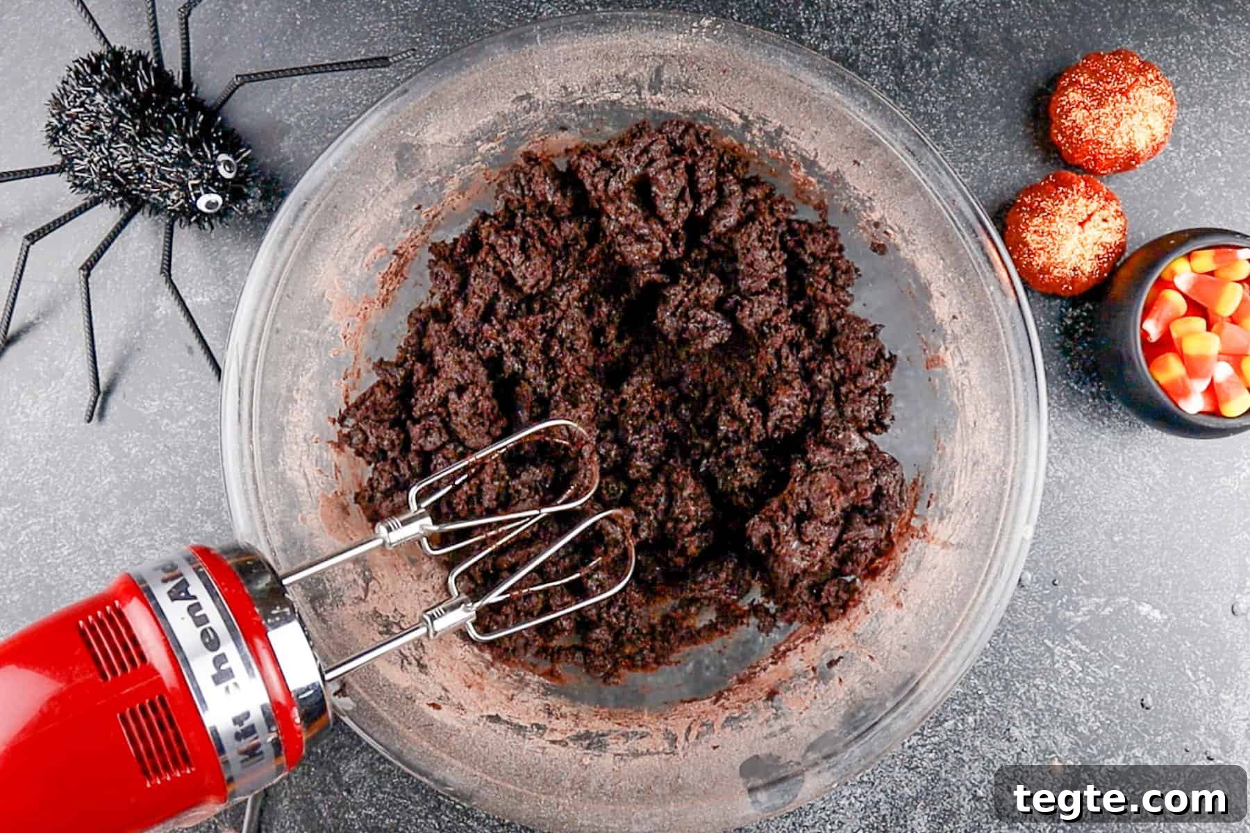 Black Cat Cookie Recipe: Soft Chocolate Drops for Halloween 7 wet and dry ingredients combined to form dough in a glass bowl.
