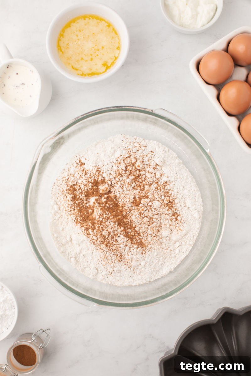 butter pecan cake mix with ground nutmeg in a mixing bowl