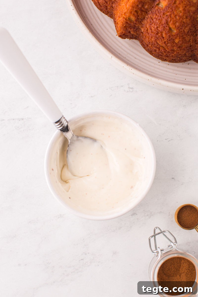 bowl of eggnog glaze with a spoon