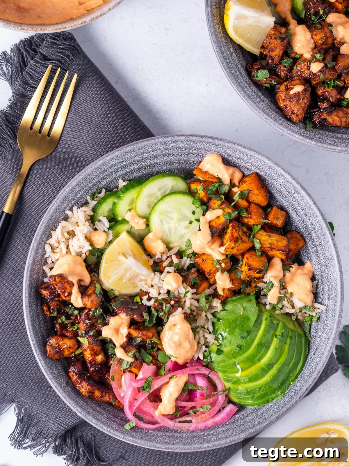 Honey Harissa Chicken Rice Bowls with Roasted Veggies 8 honey harissa chicken bowls with brown rice and avocado, drizzle with harissa aioli