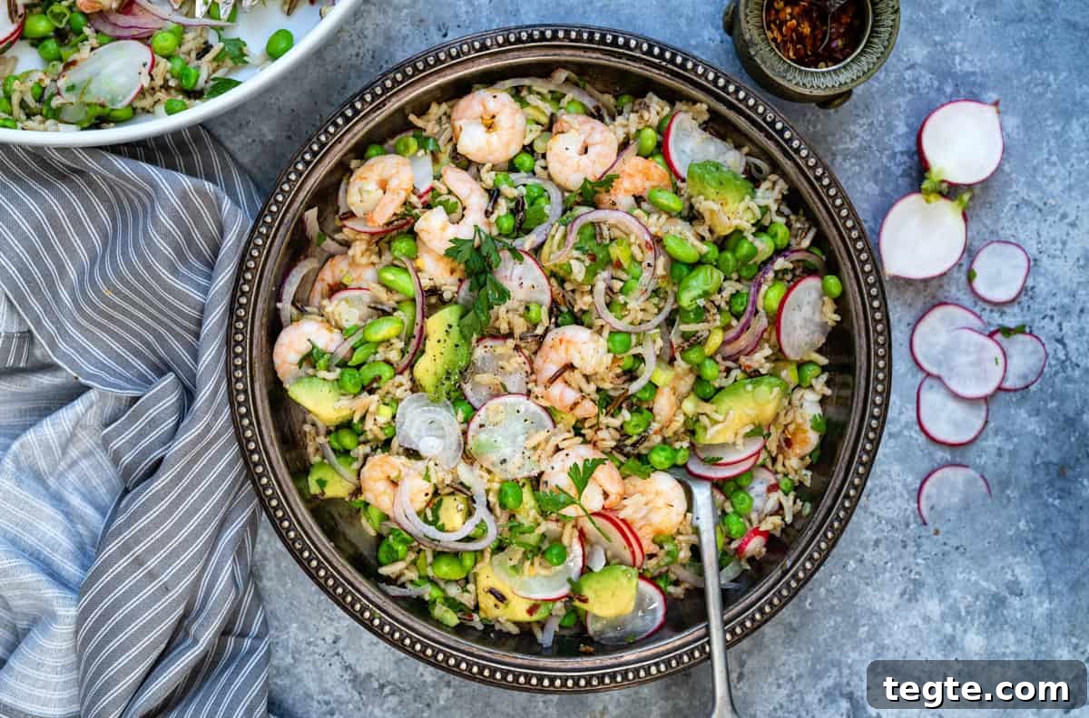 shrimp salad with avocado and rice in a bowl