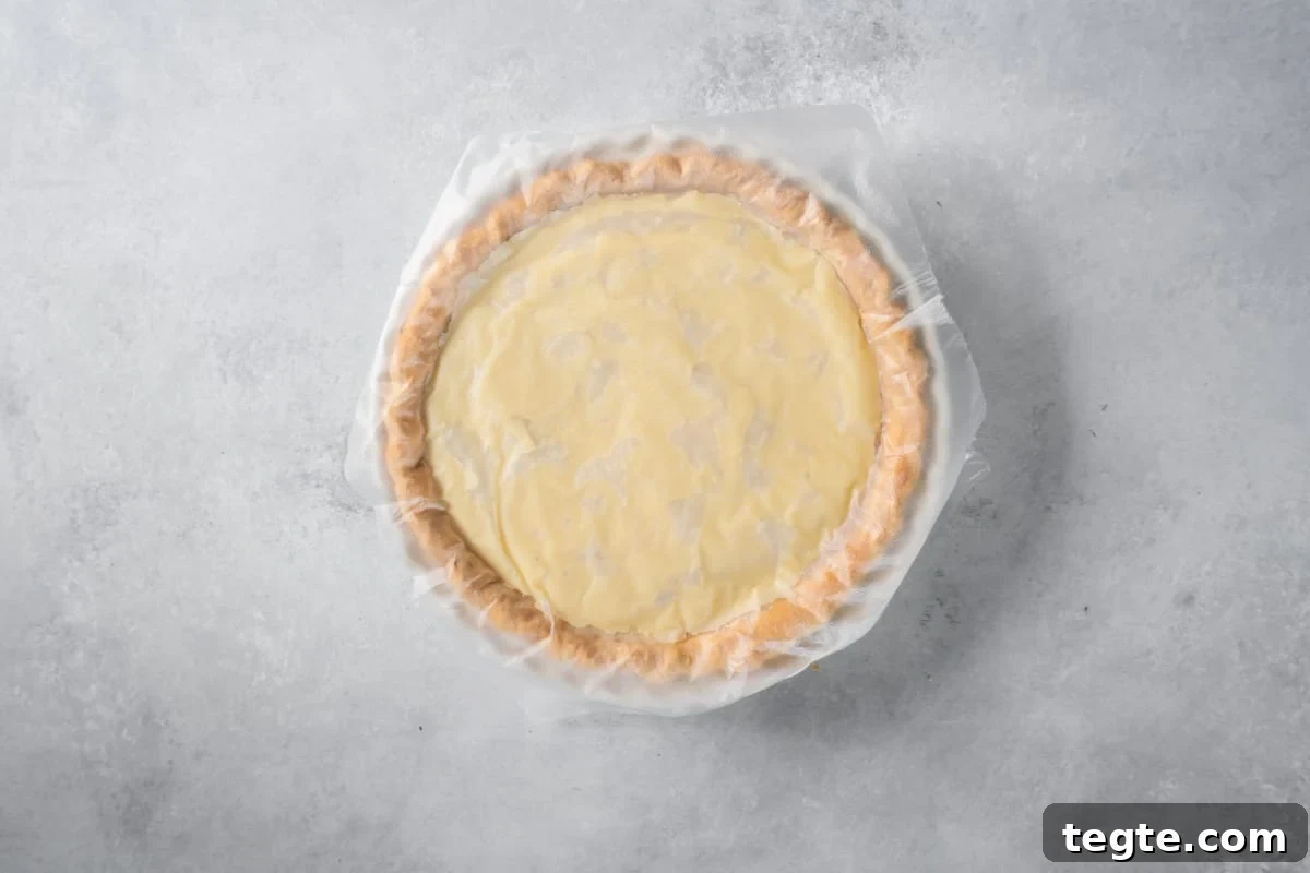 finished pie covered with a piece of wax paper