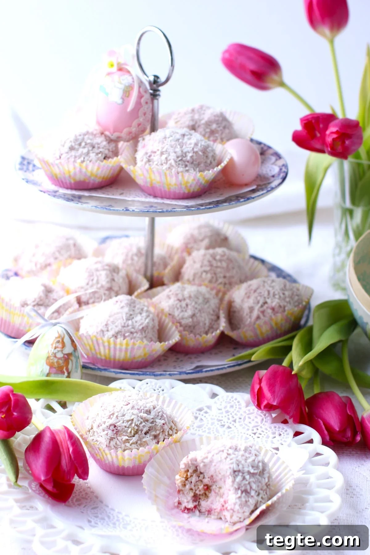 2-tiered stand with Raspberry Schneeballen, two Schneeballen on plate, tulips in vase and on table.