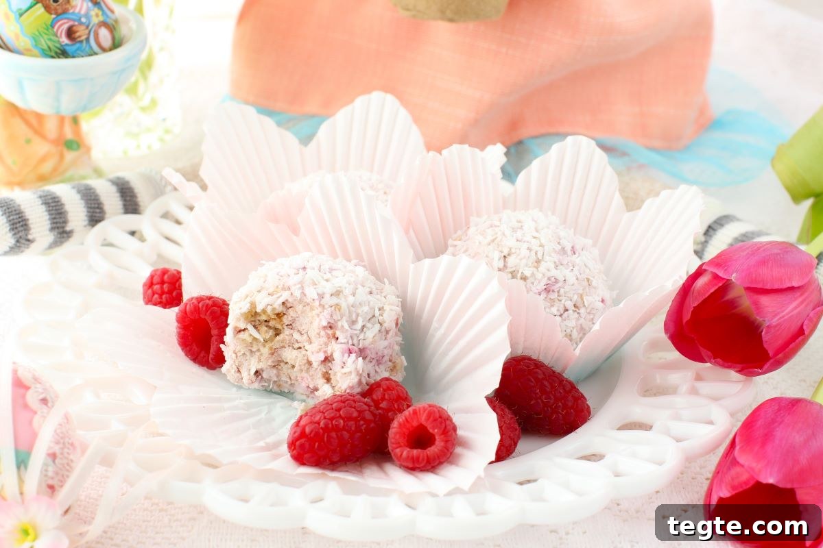 Raspberry Schneeballen on a white plate with fresh raspberries.