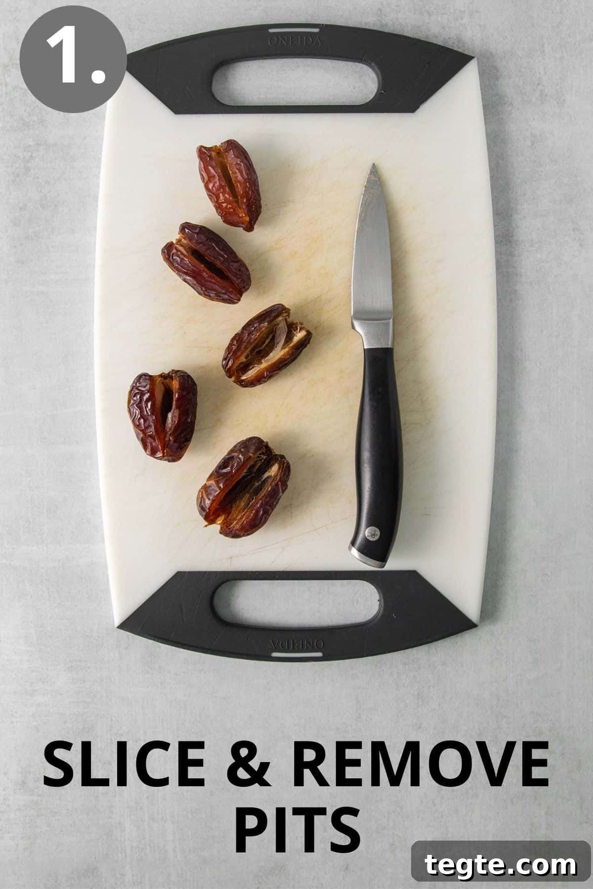 Dates and a knife on a cutting board