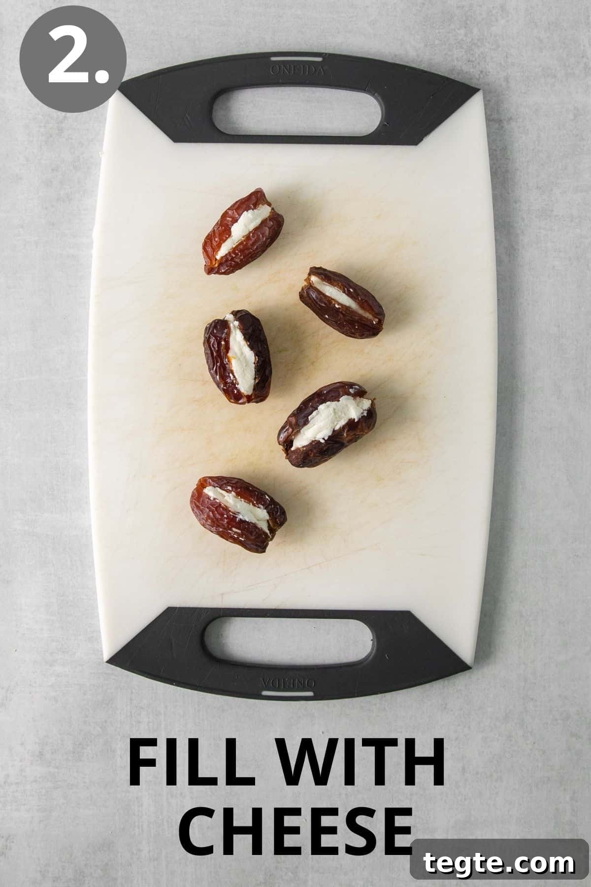 Cheese-filled dates on a cutting board