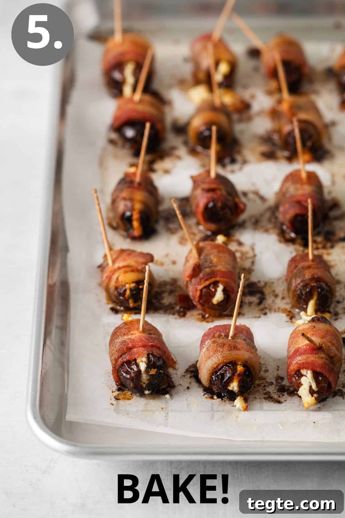 Baked bacon-wrapped dates on a baking sheet