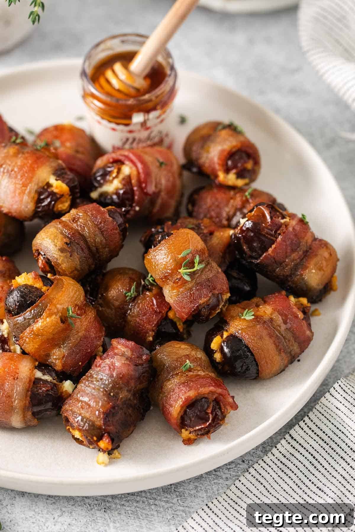 A closeup photo of bacon-wrapped dates