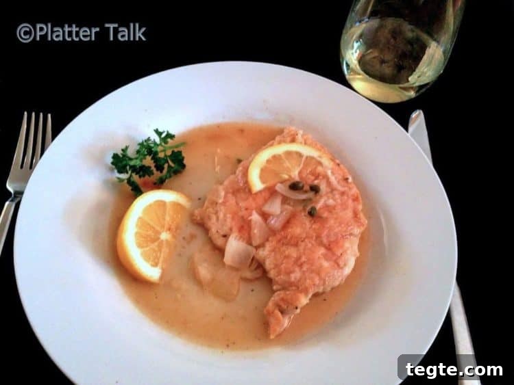Classic Chicken Piccata with Lemon Caper Sauce 7 A plate of chicken piccata