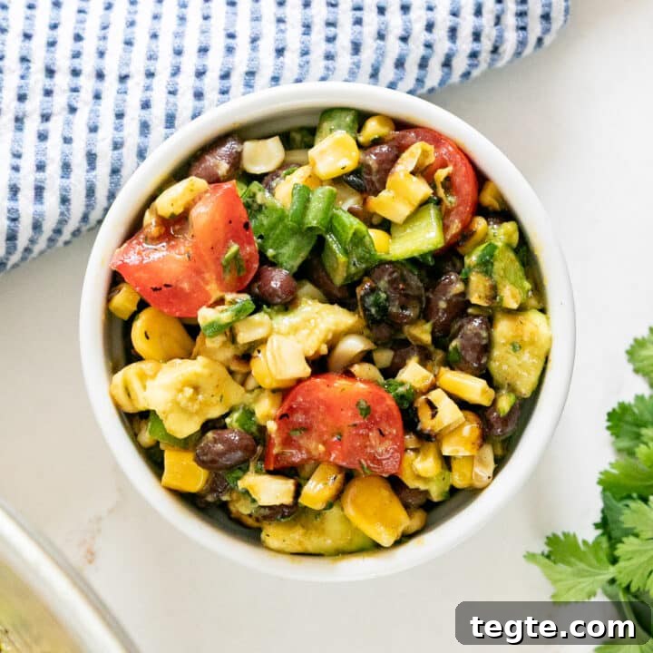 An overhead image of a bowl of corn sand black bean salad.