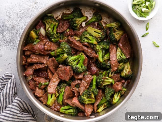 beef and broccoli stir fry in pan