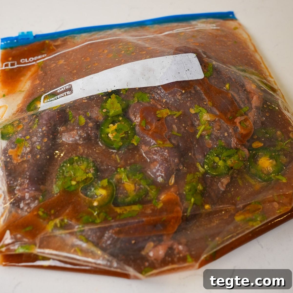 Fajita marinade in a ziplock with skirt steak.
