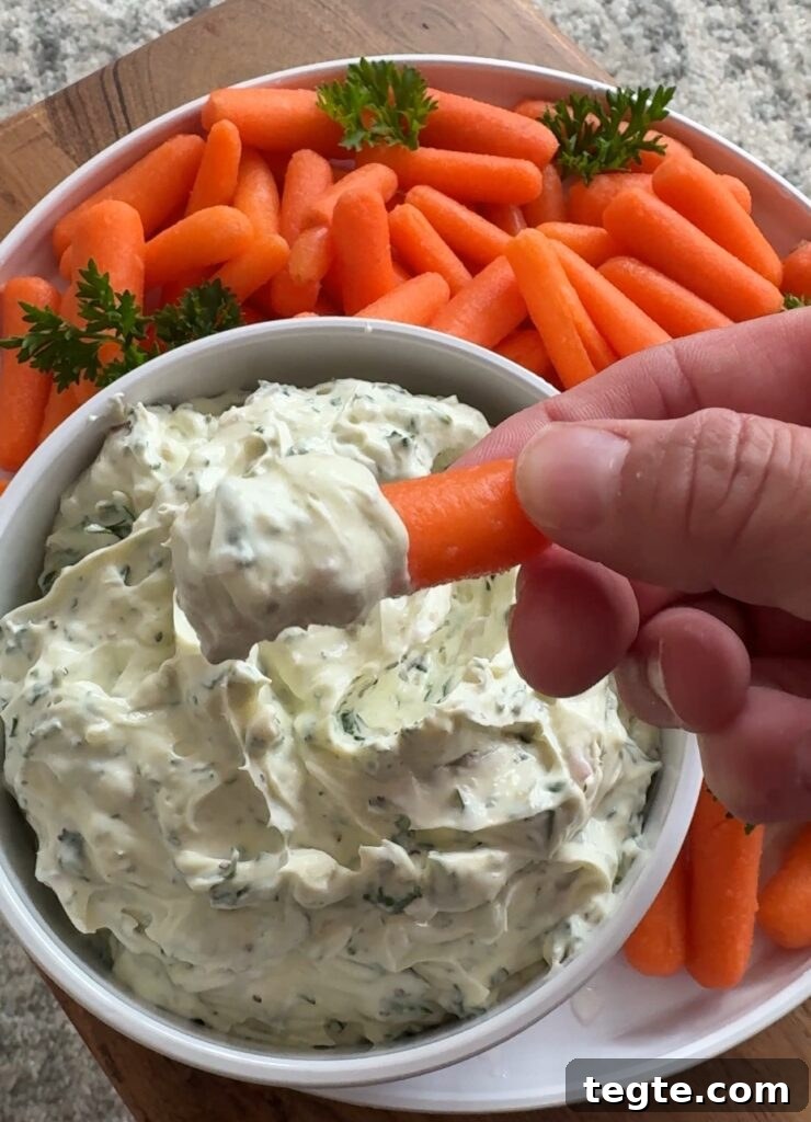 Lemon Pepper Parsley Dip with Shallots — Zesty Herb Sauce for Veggies 8 Baby carrot with the dip on it