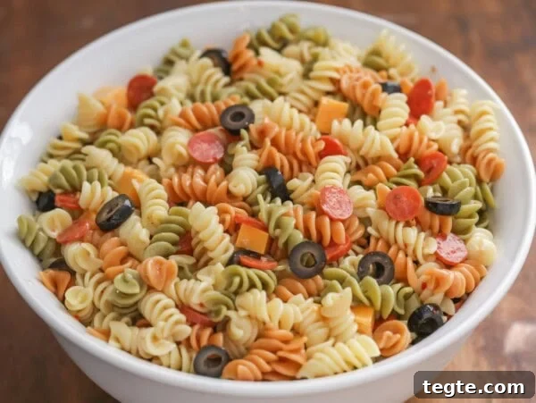 Classic Creamy Potato Salad Recipe for Picnics and BBQs 9 A bowl of pasta salad with italian dressing.