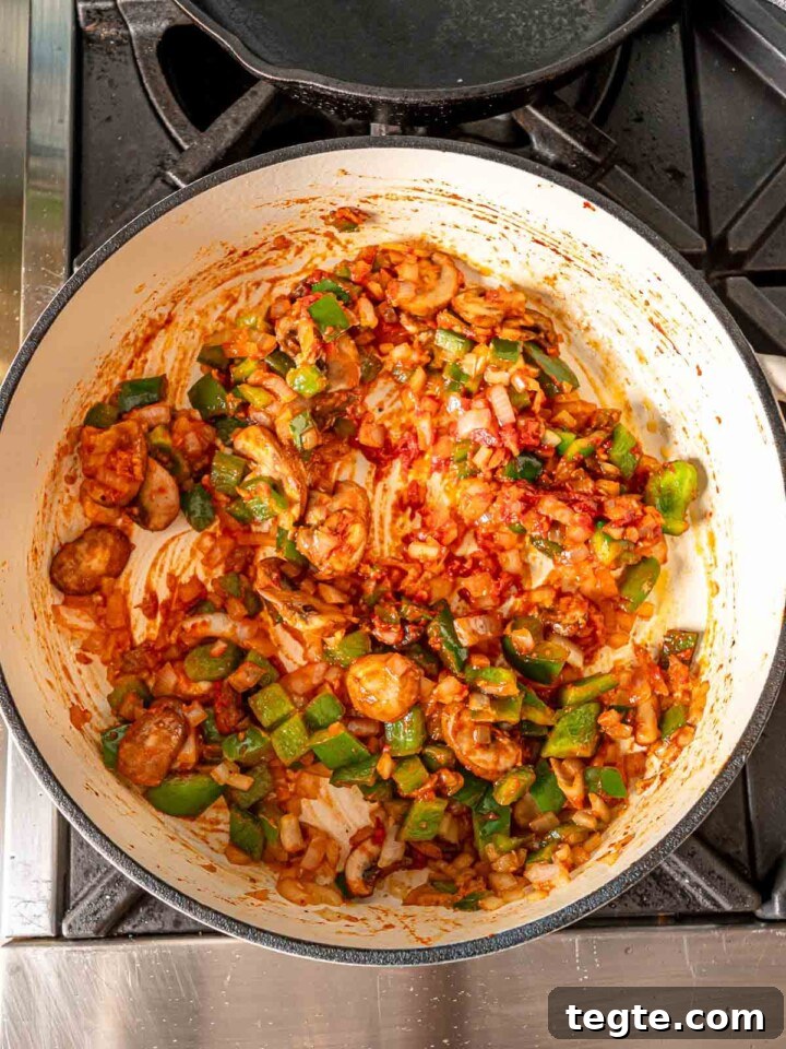 Tomato paste caramelizing in the pan.