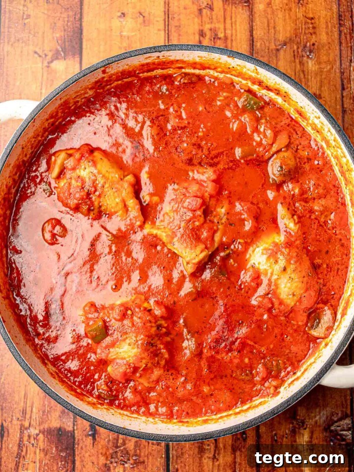 Chicken cacciatore in a pan.