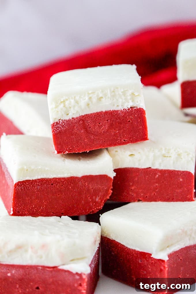red velvet fudge stacked with a red linen behind it
