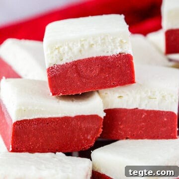 red velvet fudge stacked with a red linen behind it
