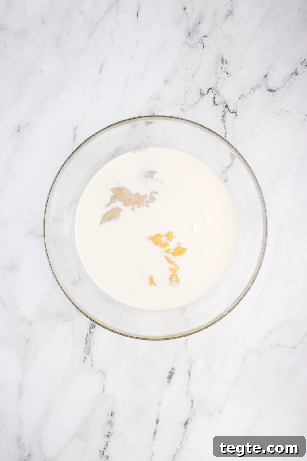 bowl with cream sauce ingredients in it for chicken tetrazzini