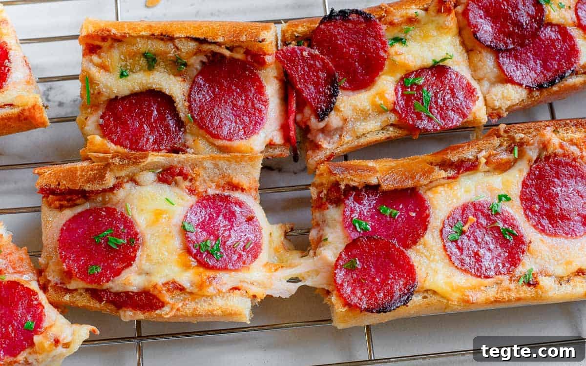 Crispy Garlic Pizza Bread Recipe: Cheesy, Golden & Fast 5 Garlic pizza bread slices on a cooling rack.