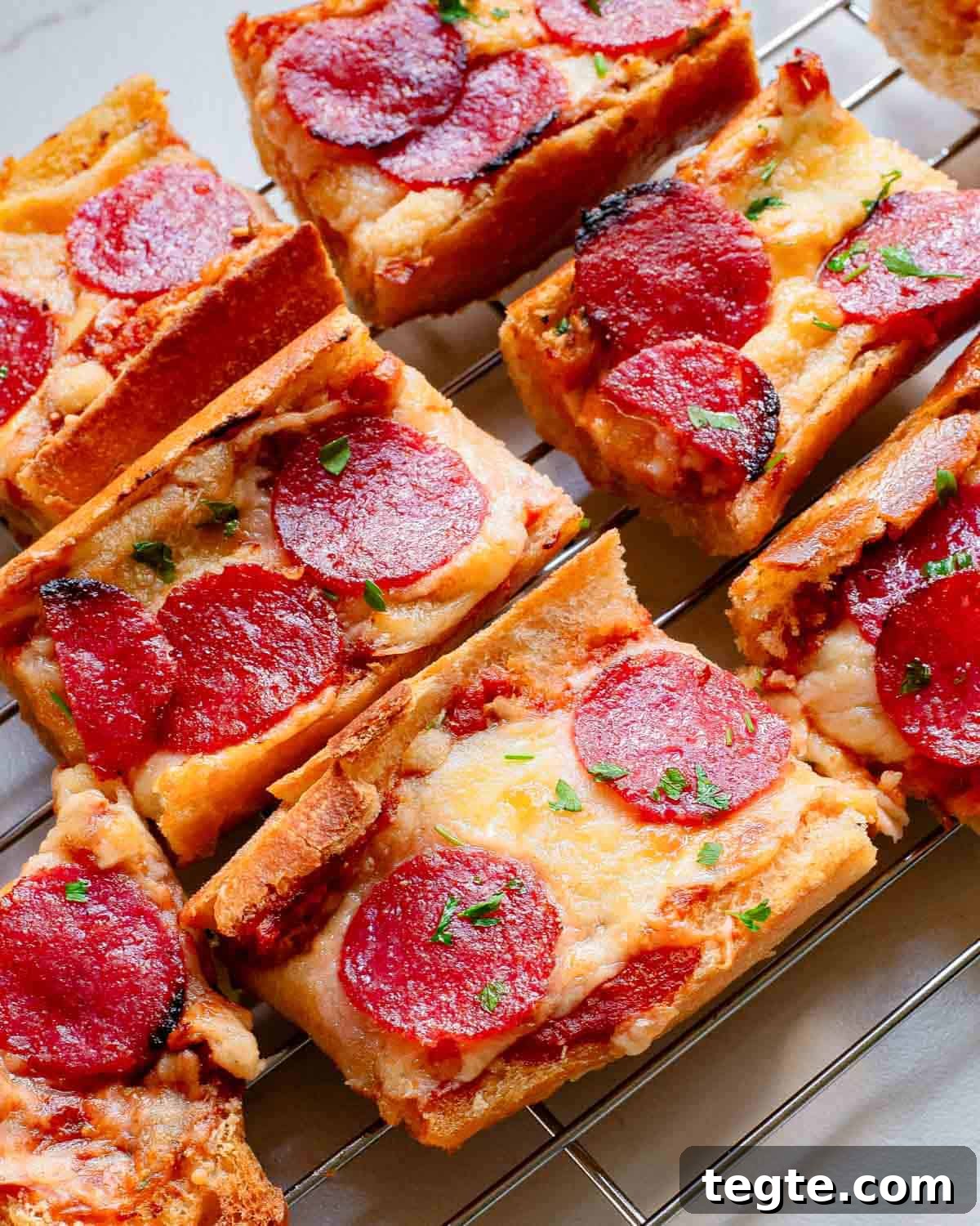 Crispy Garlic Pizza Bread Recipe: Cheesy, Golden & Fast 6 Pepperoni garlic pizza bread on a cooling rack.