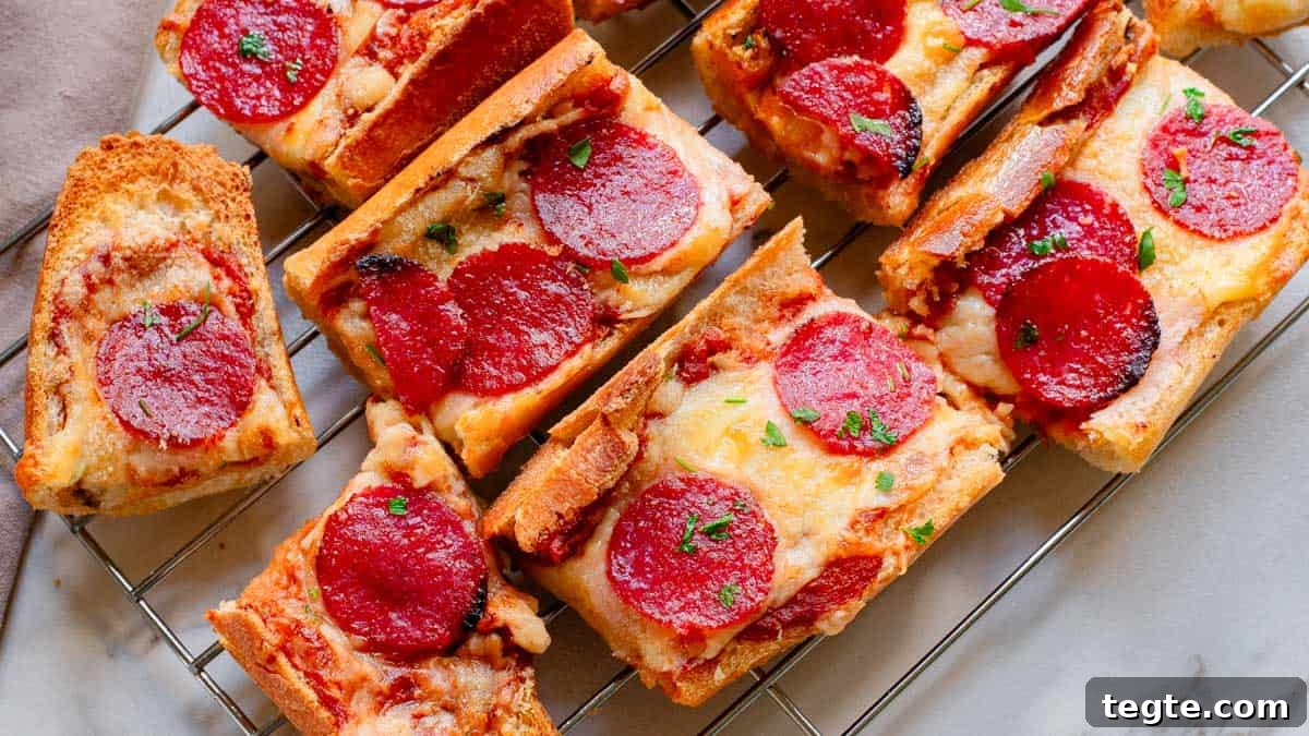 Crispy Garlic Pizza Bread Recipe: Cheesy, Golden & Fast 7 Pepperoni pizza bread on a cooling rack garnished with chopped parsley.