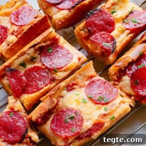 Crispy Garlic Pizza Bread Recipe: Cheesy, Golden & Fast 8 Pepperoni garlic pizza bread on a cooling rack.