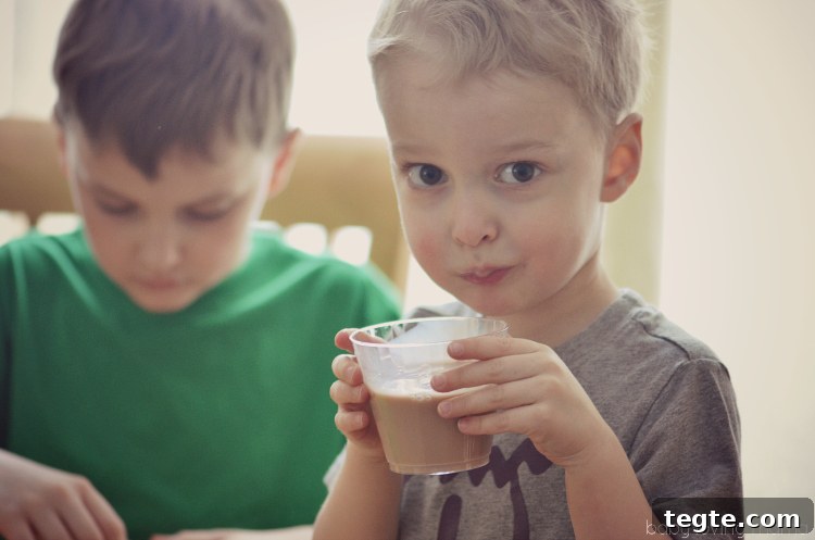 Marshmallow Popcorn Recipe with DIY Spring Treat Bags 14 Drinking TruMoo Chocolate Milk while Crafting with Kids