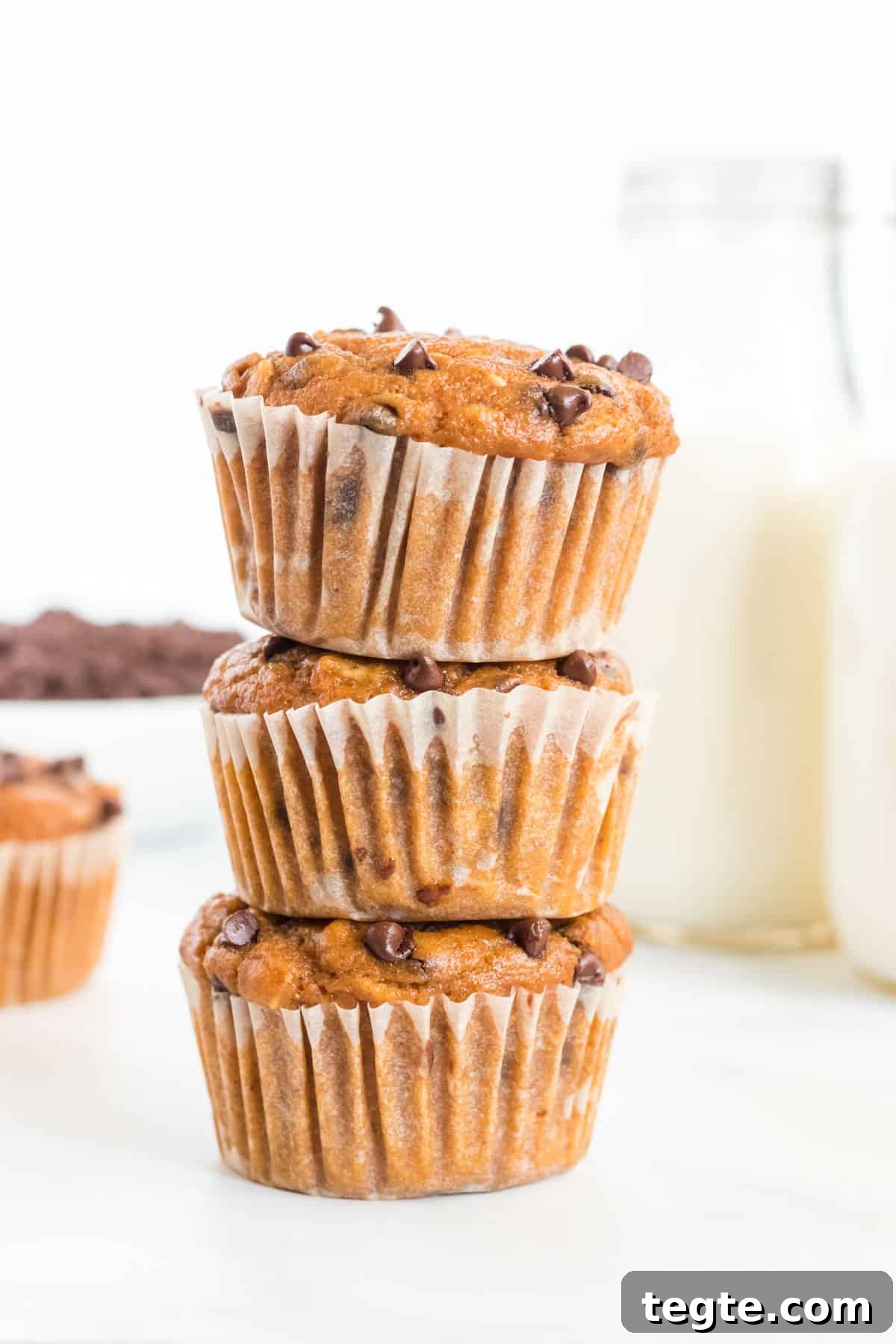 Pumpkin Chocolate Chip Muffins That Stay Moist and Flavorful 12 pumpkin chocolate chip muffins stacked on top of each other