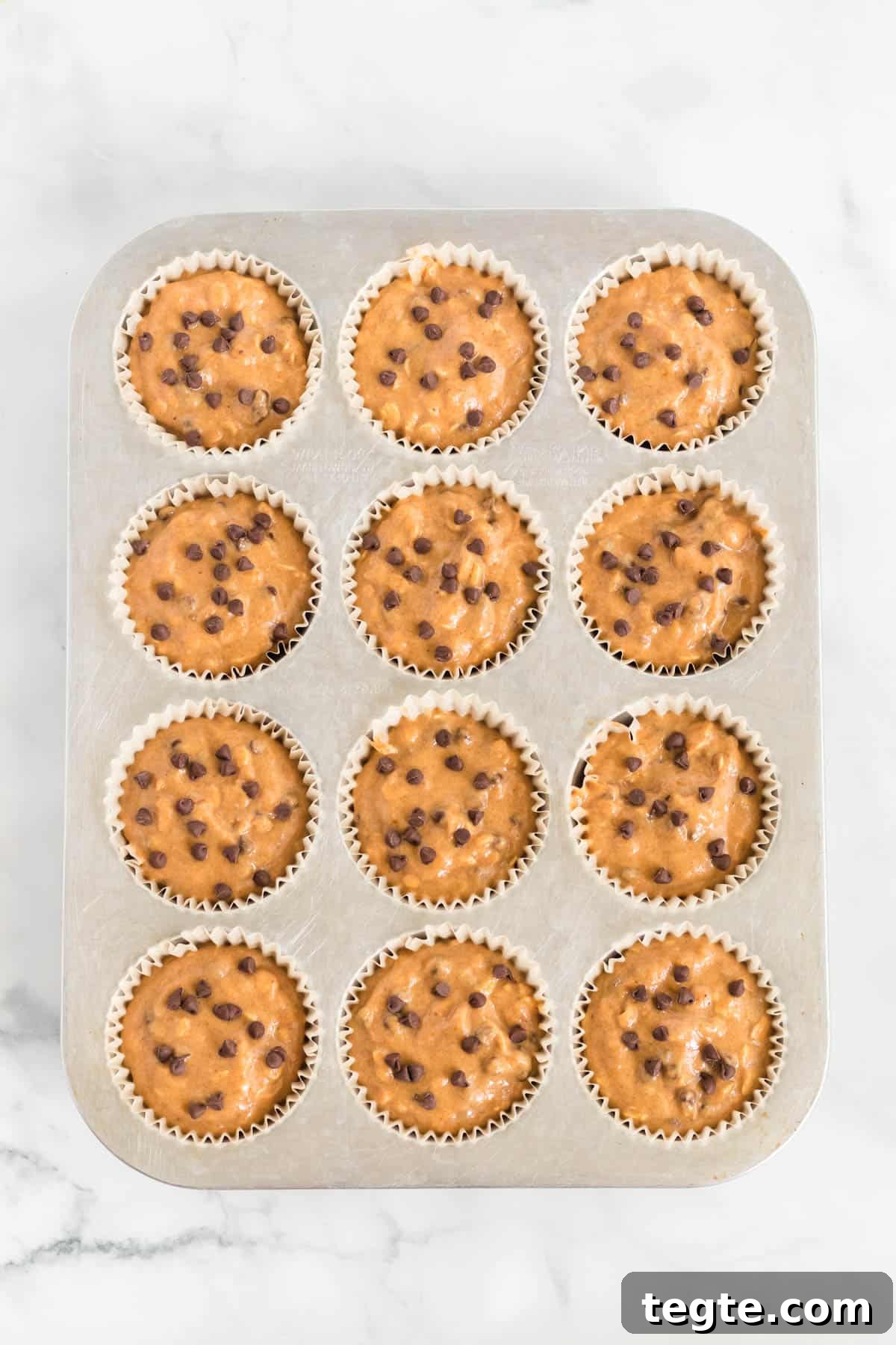 Pumpkin Chocolate Chip Muffins That Stay Moist and Flavorful 9 pumpkin muffin batter in lined muffin tins