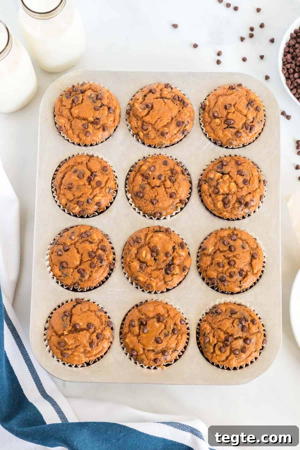 Pumpkin Chocolate Chip Muffins That Stay Moist and Flavorful 10 cooked pumpkin muffin in the muffin tin
