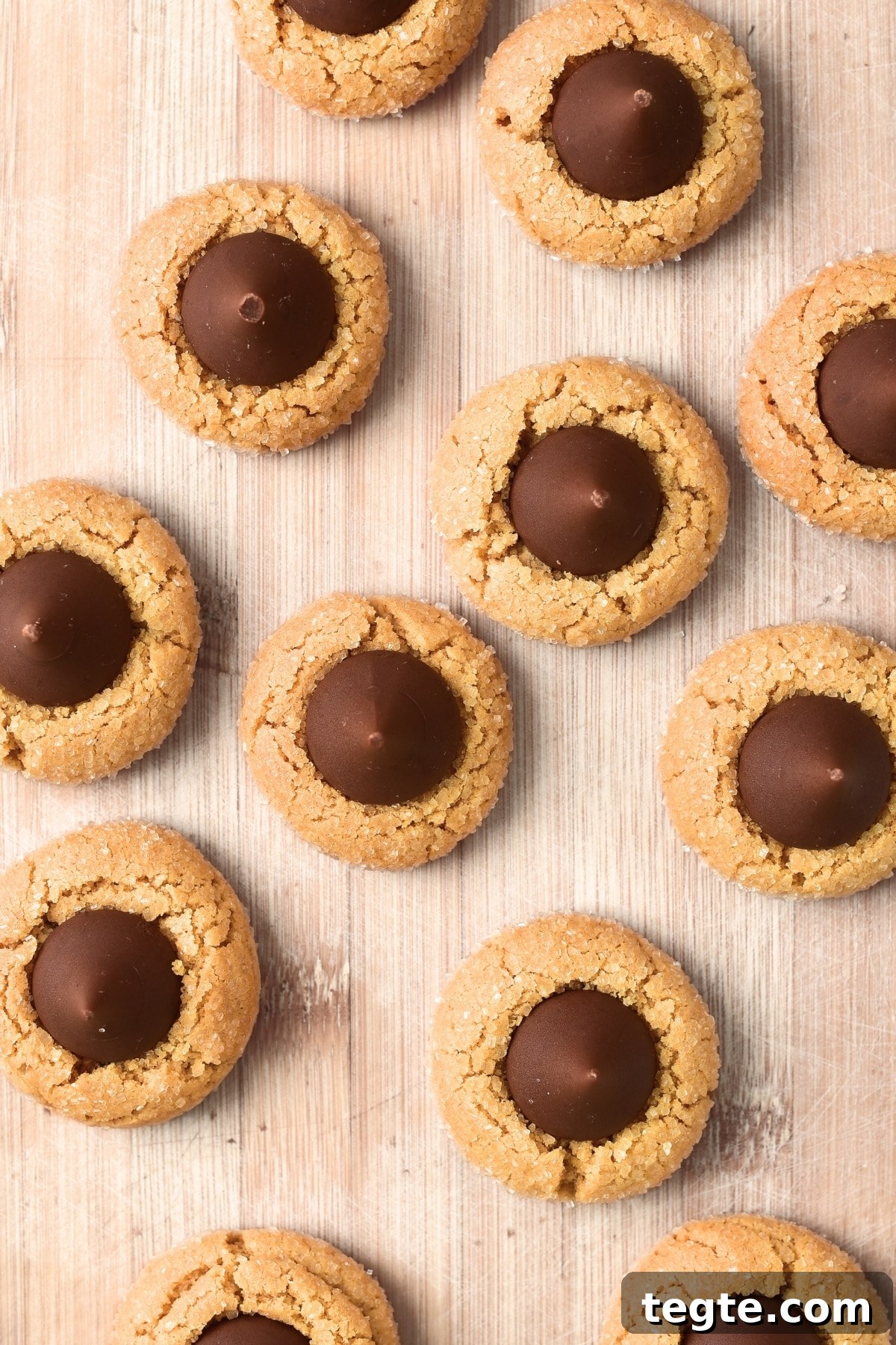Peanut butter blossoms on wooden board.