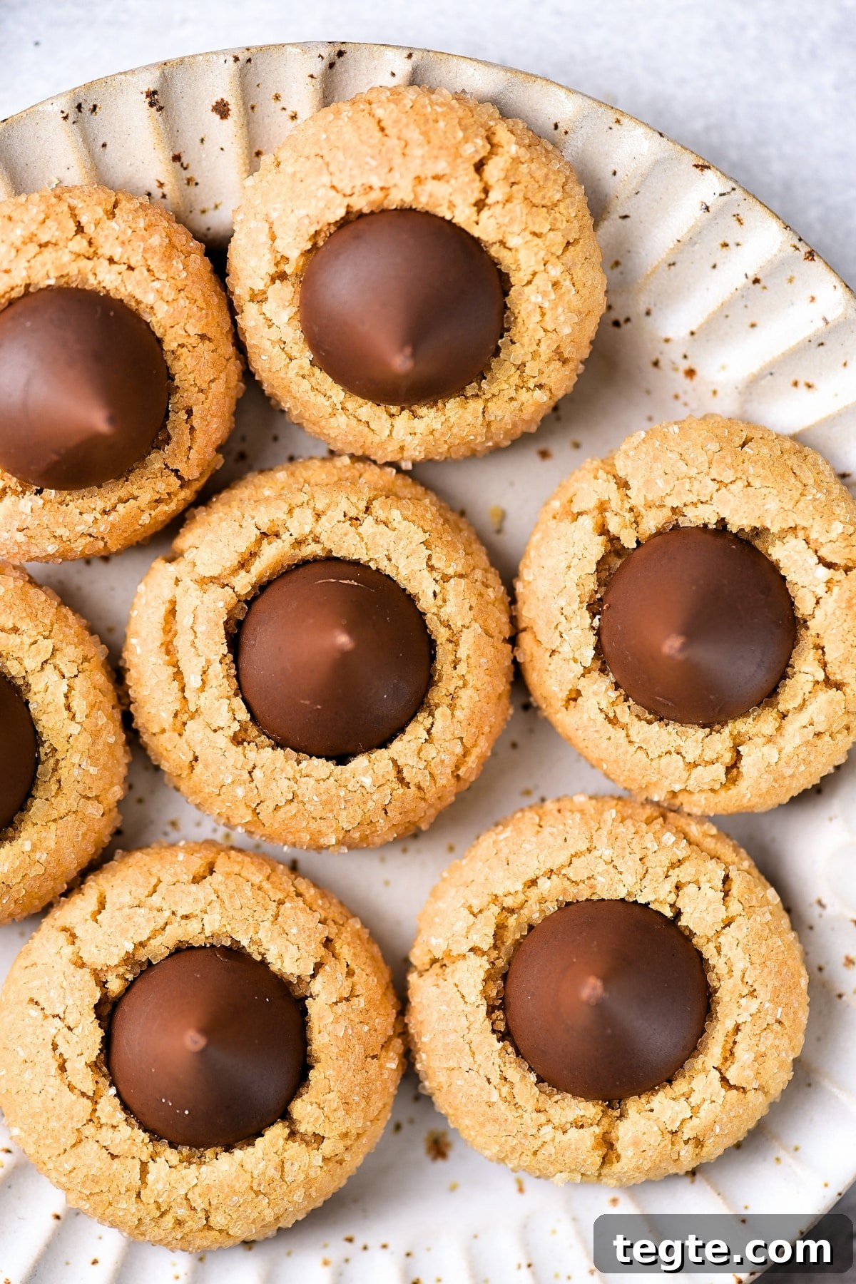 Top down view of a plate of peanut butter blossoms (gluten-free).