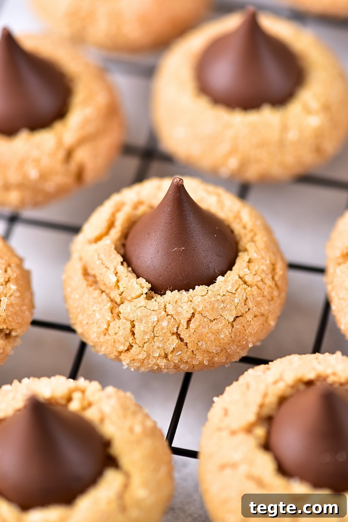 Gluten-free peanut butter kiss cookies on wire rack.